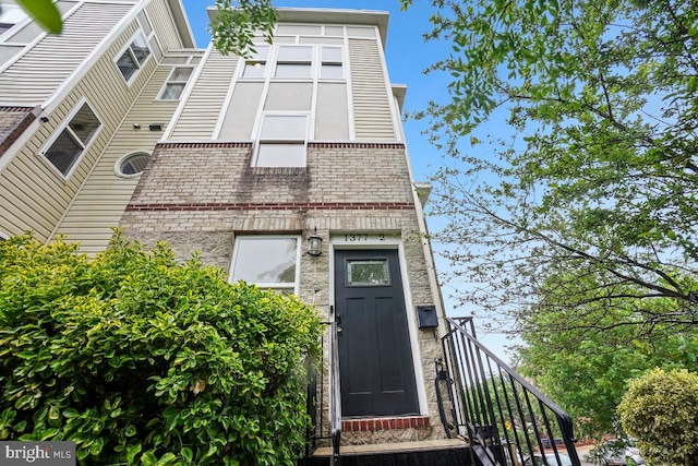 exterior space with brick siding