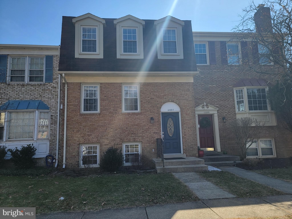 view of property with brick siding