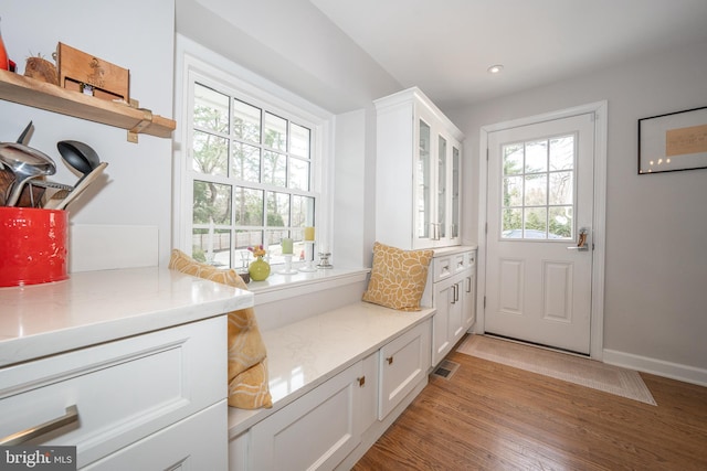 mudroom featuring recessed lighting, visible vents, baseboards, and light wood finished floors