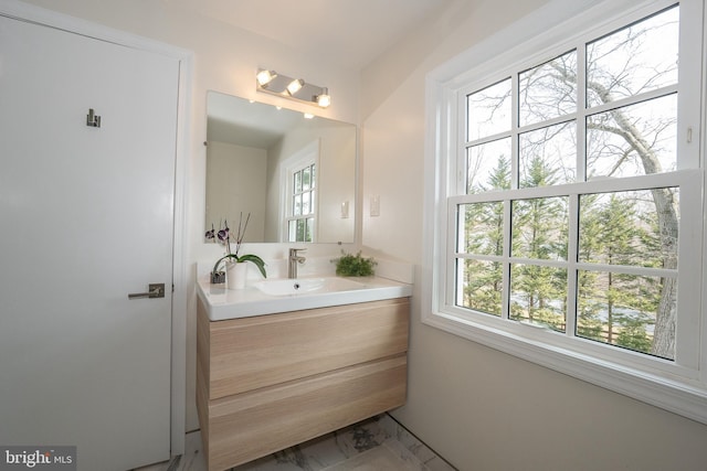 bathroom featuring vanity and marble finish floor