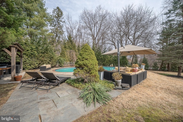 view of patio / terrace featuring an outdoor pool and fence