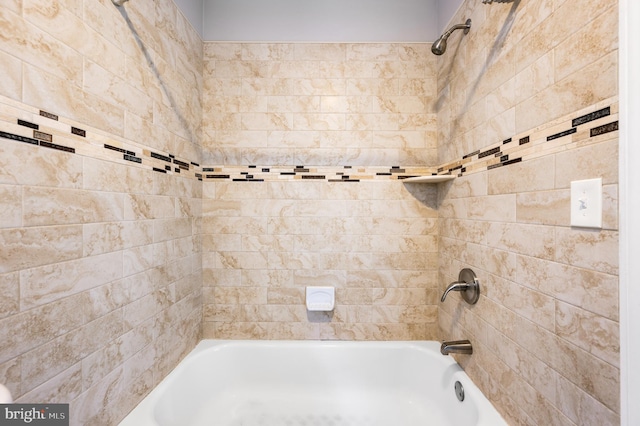 bathroom with bathing tub / shower combination