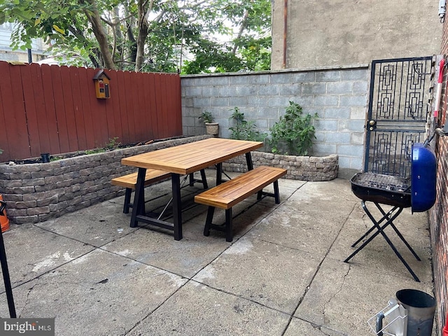 view of patio featuring a fenced backyard and outdoor dining space