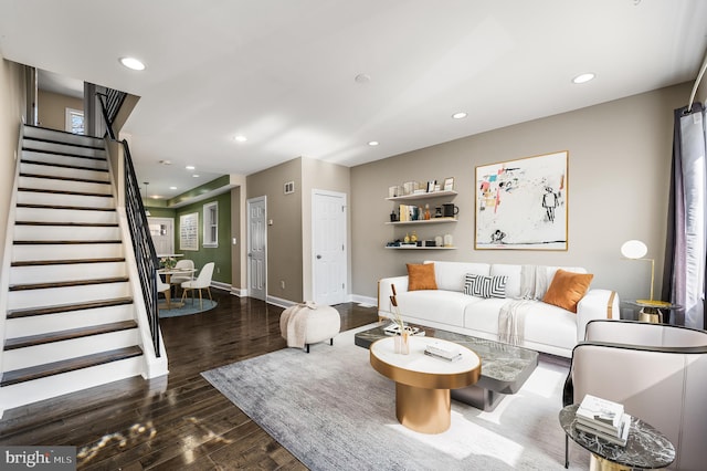 living room featuring stairway, recessed lighting, baseboards, and wood finished floors