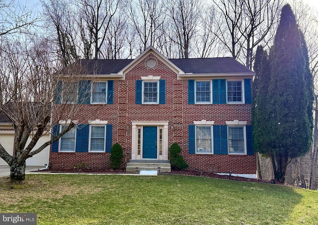 colonial-style house with brick siding and a front lawn