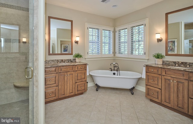 bathroom with a sink, visible vents, two vanities, and a shower stall