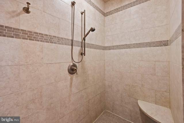 full bath featuring a tile shower