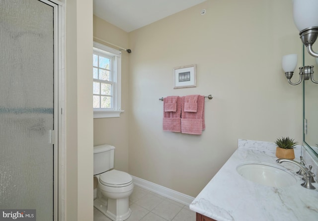 full bathroom with tile patterned flooring, baseboards, toilet, a shower with shower door, and vanity