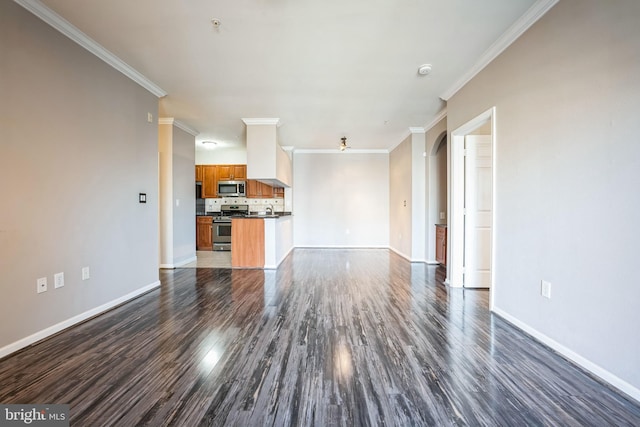 unfurnished living room featuring baseboards, dark wood finished floors, and crown molding