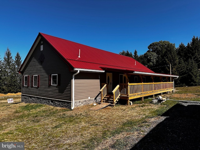 view of front of house featuring a porch and metal roof