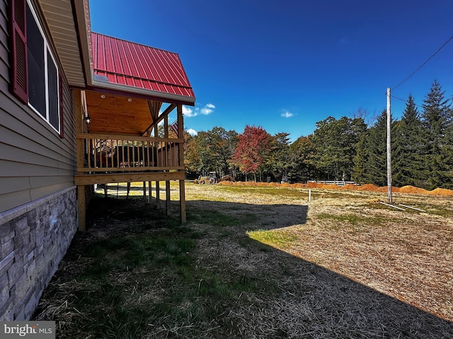 view of yard with a wooden deck