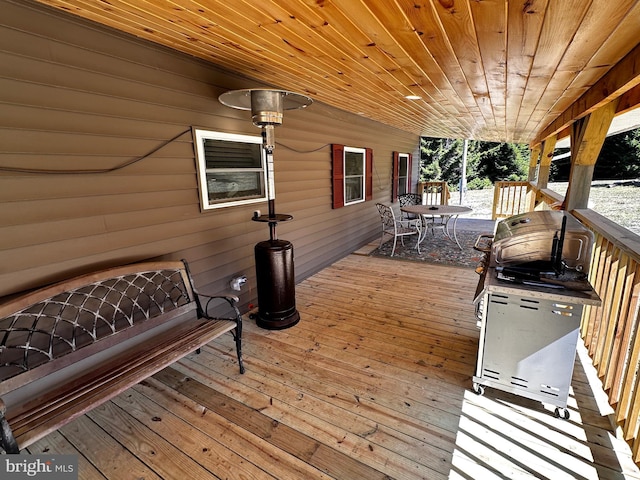 wooden deck featuring outdoor dining space