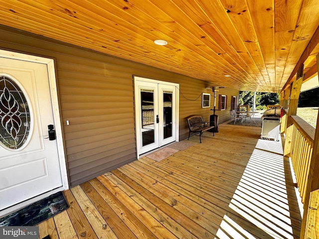 deck with french doors and grilling area