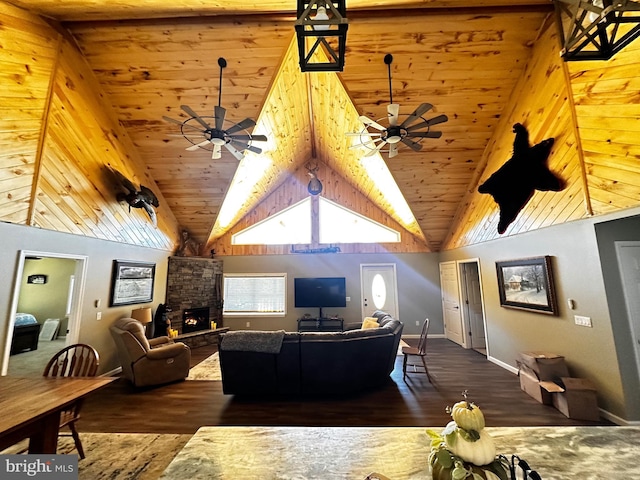 living room with a fireplace, high vaulted ceiling, ceiling fan, and wood finished floors