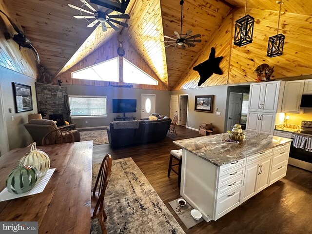 kitchen featuring range with electric cooktop, white cabinets, high vaulted ceiling, and a ceiling fan