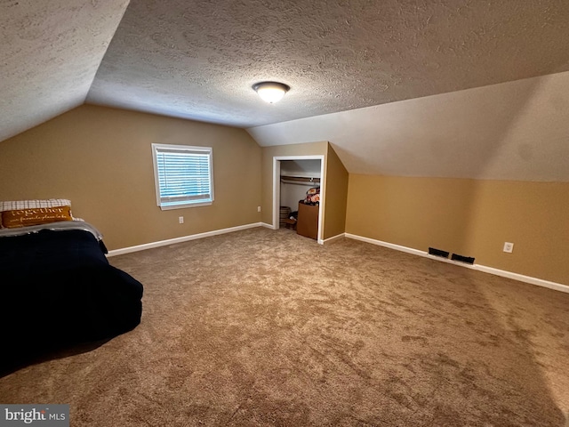 bonus room with visible vents, baseboards, carpet, and vaulted ceiling