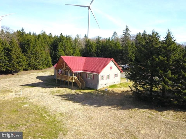 bird's eye view with a wooded view