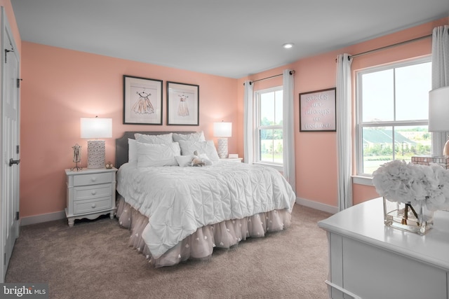 bedroom with carpet flooring and baseboards