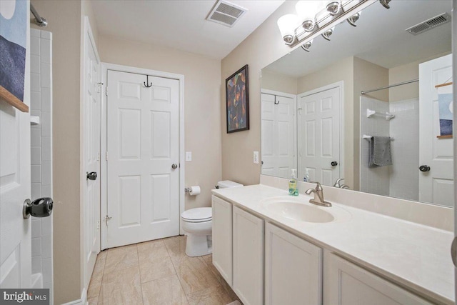 full bathroom featuring visible vents, toilet, walk in shower, and vanity