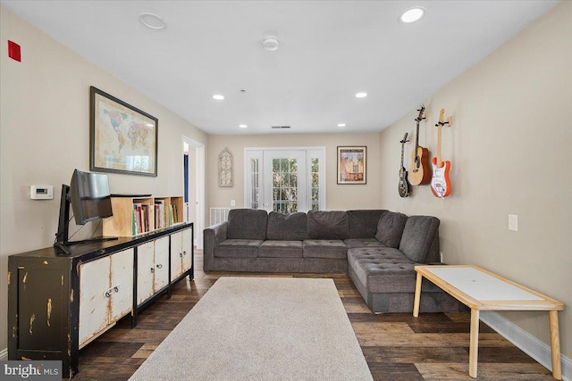 living room with dark wood-type flooring, recessed lighting, and visible vents