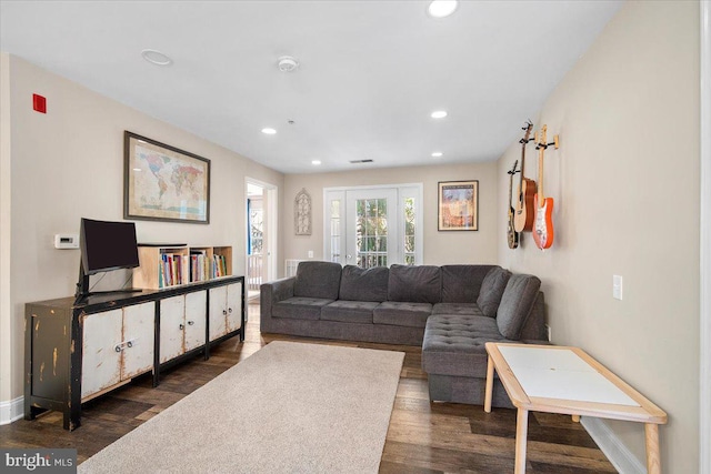 living area with recessed lighting and dark wood-type flooring