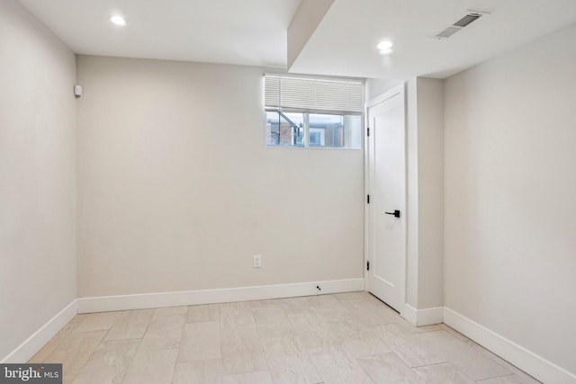 unfurnished room featuring recessed lighting, visible vents, and baseboards