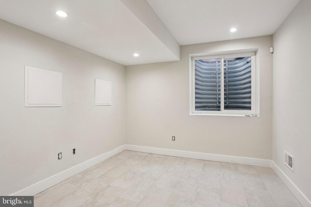 unfurnished room with recessed lighting, visible vents, and baseboards