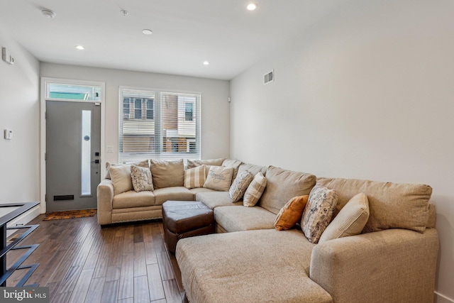 living area featuring visible vents, recessed lighting, and dark wood-type flooring