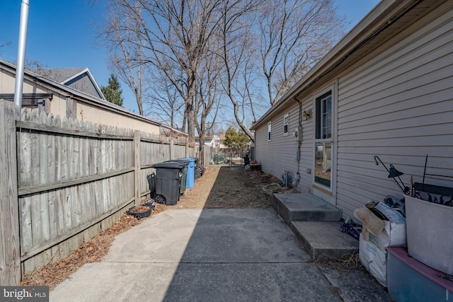 view of home's exterior with a patio and a fenced backyard