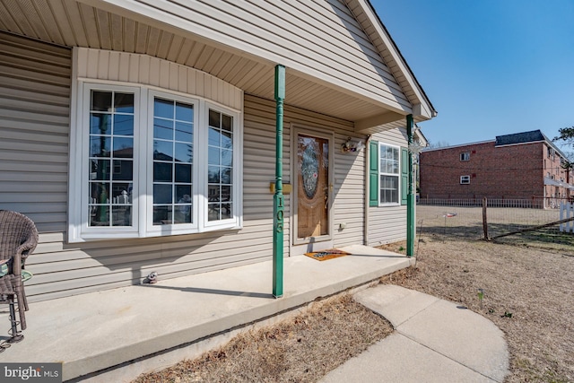 property entrance featuring fence