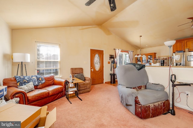 living area featuring lofted ceiling, light colored carpet, and ceiling fan