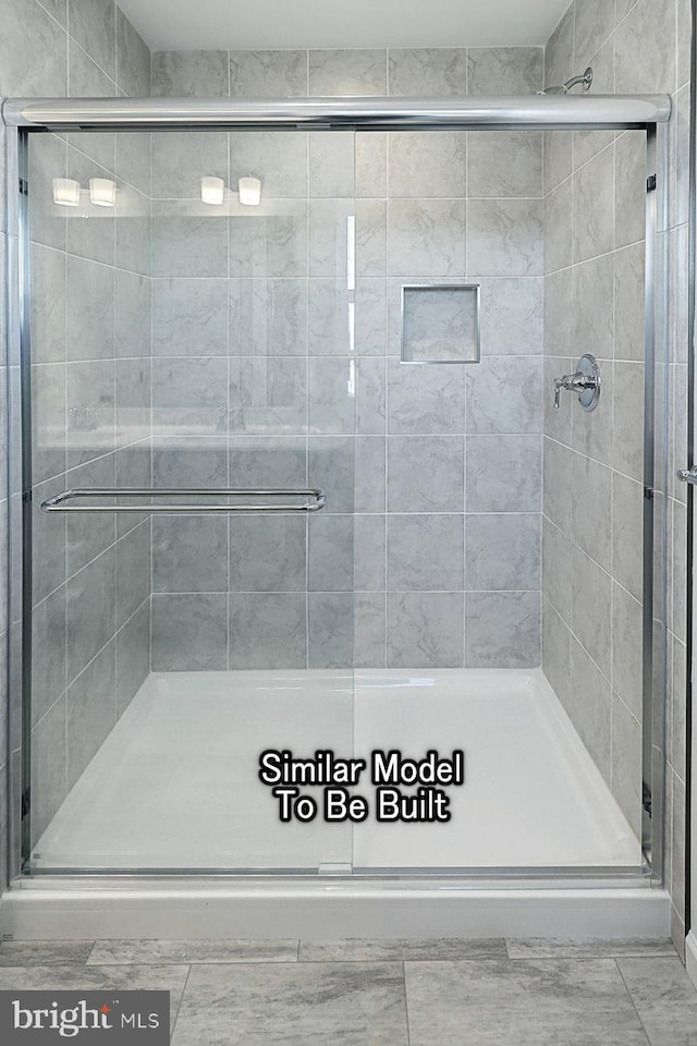 bathroom with a stall shower