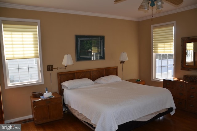 bedroom featuring visible vents, crown molding, ceiling fan, baseboards, and dark wood finished floors