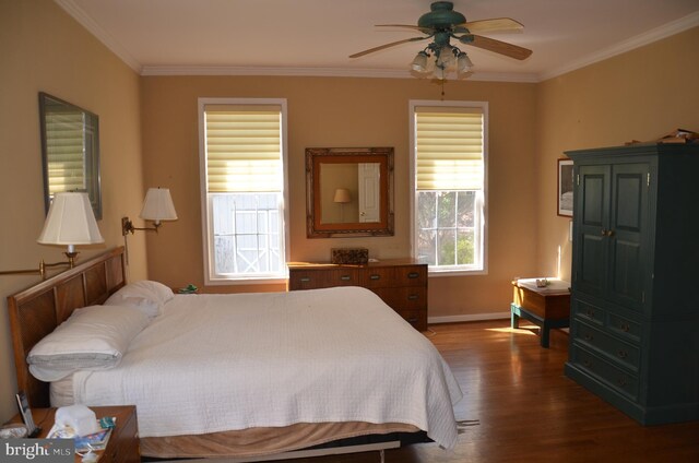 bedroom featuring dark wood-style floors, baseboards, ornamental molding, and a ceiling fan