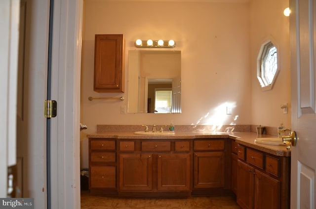 bathroom with double vanity and a sink