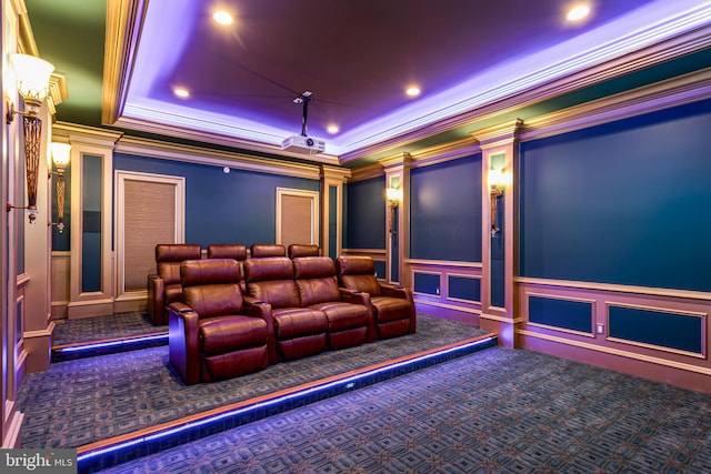 carpeted cinema room featuring crown molding, a decorative wall, decorative columns, and recessed lighting