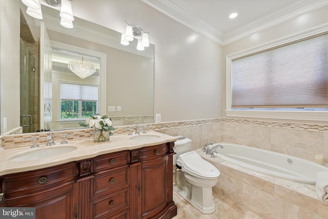 bathroom featuring crown molding, a bath, double vanity, and a sink