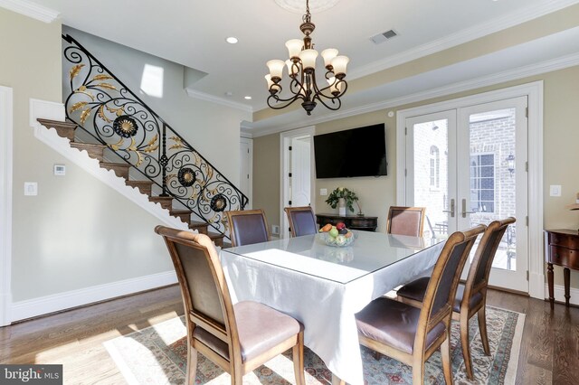 dining room featuring visible vents, a notable chandelier, stairway, french doors, and dark wood-style flooring