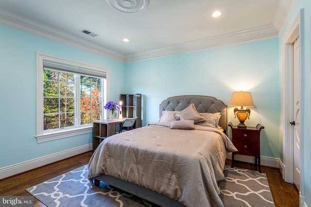 bedroom featuring recessed lighting, ornamental molding, baseboards, and wood finished floors