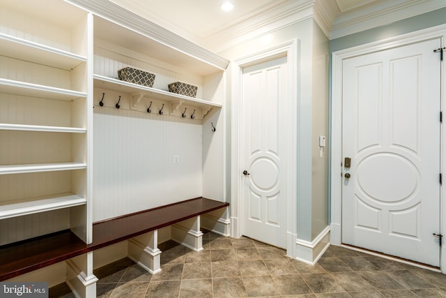 mudroom with baseboards and crown molding