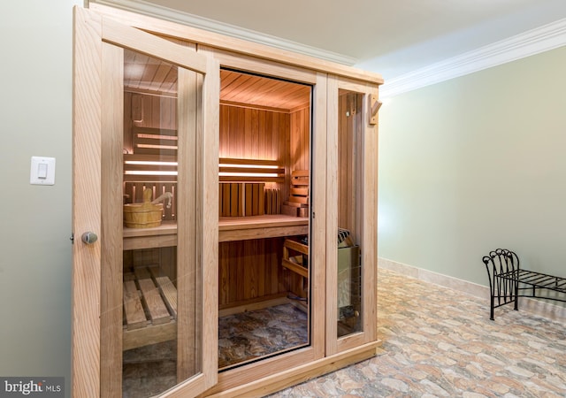 view of sauna / steam room featuring stone finish flooring and baseboards