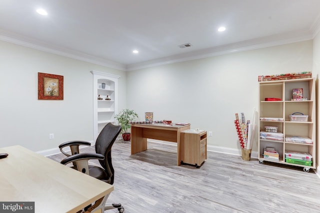 office area with light wood-style flooring, baseboards, and ornamental molding