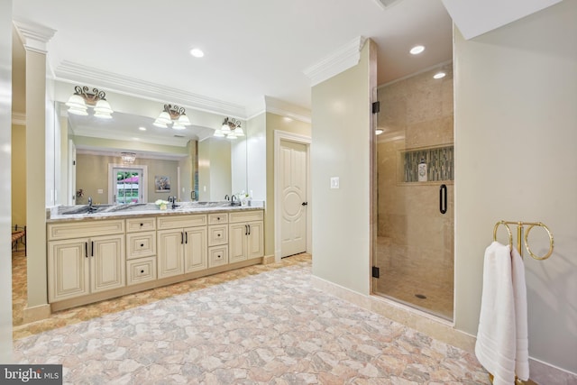 bathroom featuring baseboards, double vanity, ornamental molding, a stall shower, and a sink