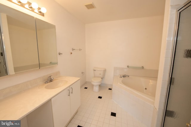 bathroom featuring tile patterned floors, visible vents, a garden tub, toilet, and vanity