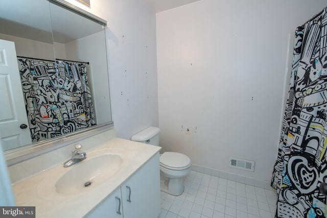 bathroom with tile patterned floors, visible vents, toilet, baseboards, and vanity