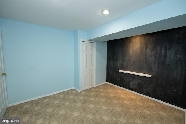 interior space featuring baseboards and carpet floors