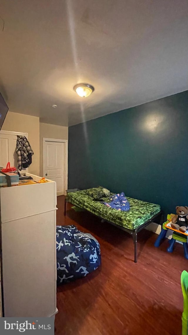 bedroom with wood finished floors