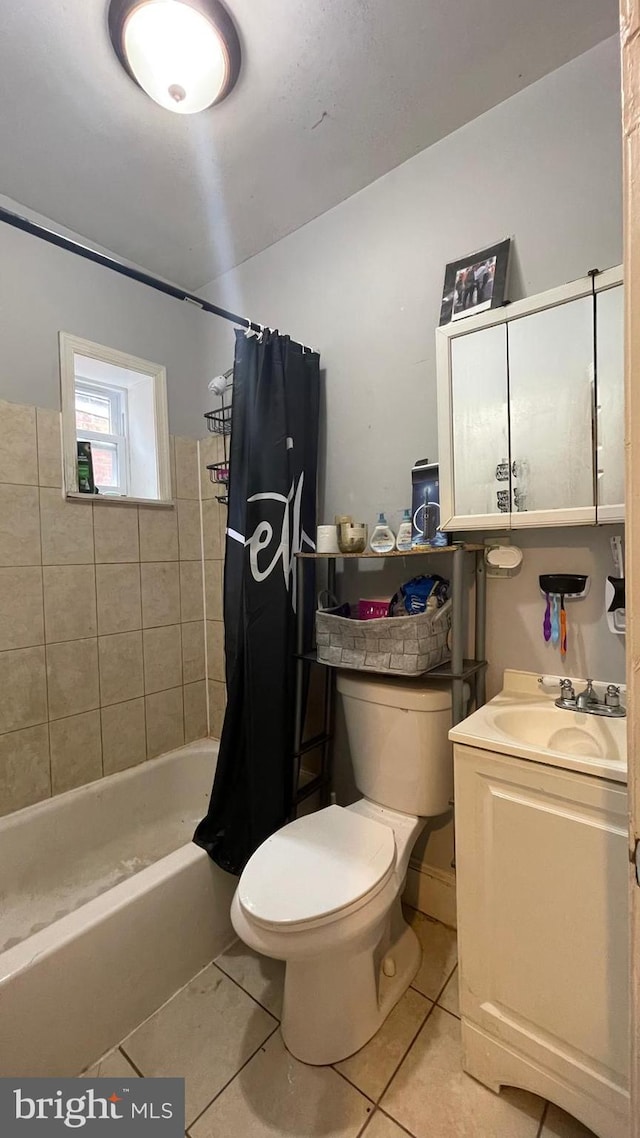 full bathroom with tile patterned floors, shower / bath combination with curtain, toilet, and vanity