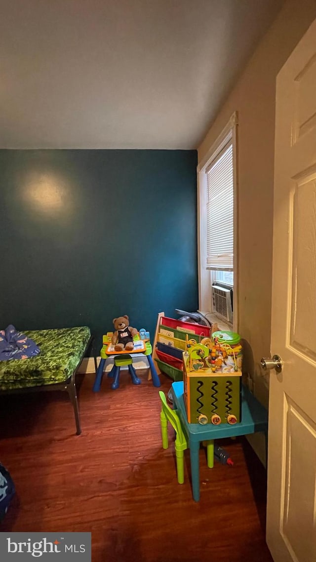 playroom with cooling unit and wood finished floors