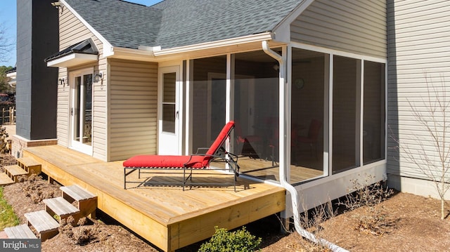 wooden deck featuring a sunroom